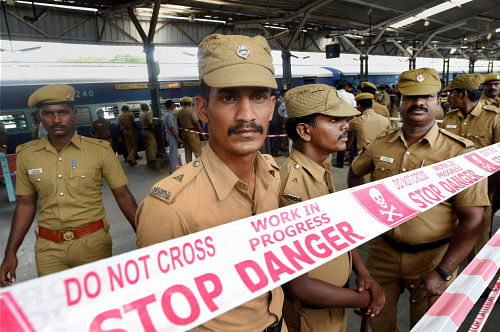 Police cordon off the spot near a train that was ripped by two blasts at the Chennai Central railway station on Thursday. PTI Photo