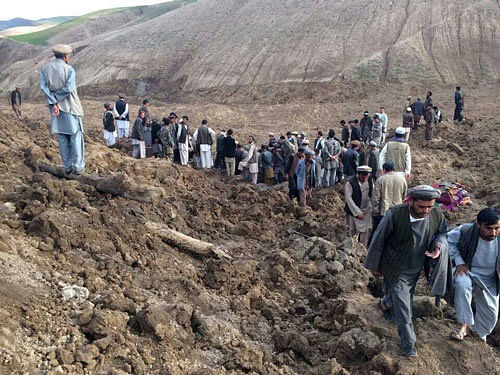Afghans search for survivors after a massive landslide landslide buried a village Friday, May 2, 2014 in Badakhshan province, northeastern Afghanistan, which Afghan and U.N. officials say left hundreds of dead and missing missing. AP