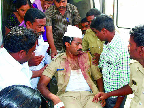 Five policemen were injured here, one of them seriously, when hundreds of locals attacked the personnel while staging a road blockade over frequent power cuts. DH file photo for representation only
