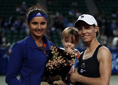 Sania Mirza alongwith her doubles partner Cara Black stormed into the finals of the Portugal Open with a straight-set victory over third seeded American pair of Liezel Huber and Lisa Raymond here. Reuters file photo
