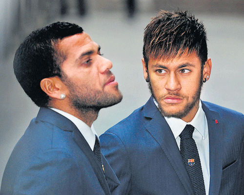 Dani Alves, seen with Neymar, was the target of a racist taunt. Reuters photo