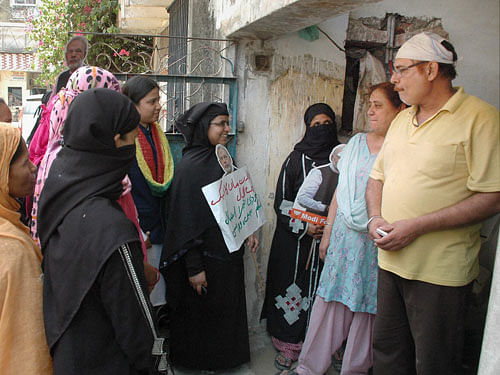 Muslim women during door to door campiagn for BJP PM candidate Narendra Modi in Varanasi on Saturday. PTI Photo