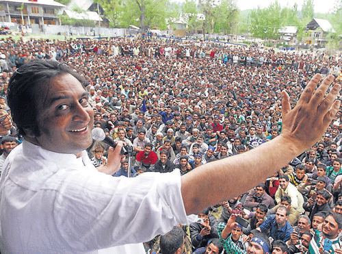 Jammu and Kashmir Peoples Conference chairman Sajjad Gani Lone addresses party workers during an election campaign rally for his party candidate at Langate, north Kashmir's Kupwara district, on Sunday. PTI