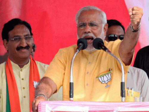 Within hours of Narendra Modi's address to a rally in Faizabad where he invoked Lord Ram, the Election Commission sought a report from the district authorities about his speech and the stage backdrop. PTI photo