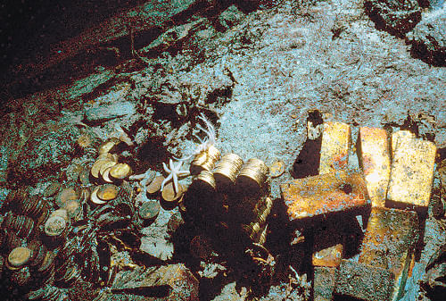 Gold bars and coins seen at the shipwreck in 1989. AP photo