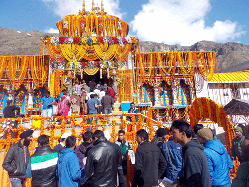 Devotees wait to offer prayers to Lord Badri-Vishal after portals of Badrinath were opened at Brahm Muhurat on Monday. PTI Photo