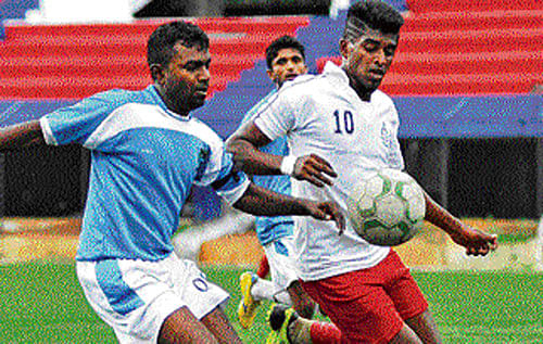 lEAVE IT, SIR... Vijay of RWF (left) vies for the ball with Rajesh of CIL in the Super Division League on Tuesday. DH PHOTO