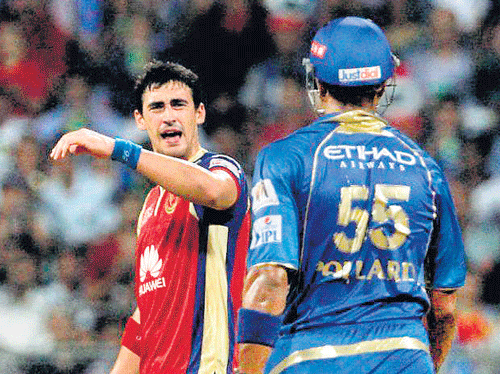 Mitchell Starc (left) and Kieron Pollard exchange angry words during their IPL match in Mumbai on Tuesday. BCCI