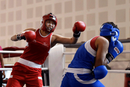 Aspiring women boxers spar at the Commonwealth Games trials for the core group in New Delhi on Tuesday. PTI Photo