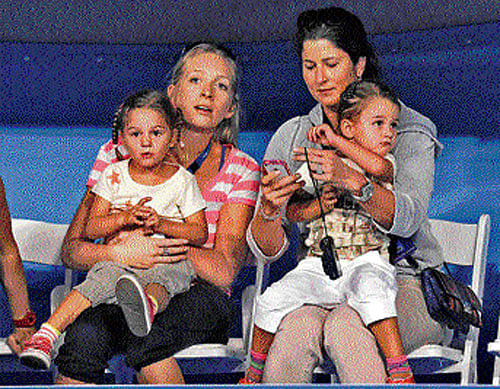 Federer's wife Mirka (right) with their twin girls, Myla Rose and Charlene Riva.