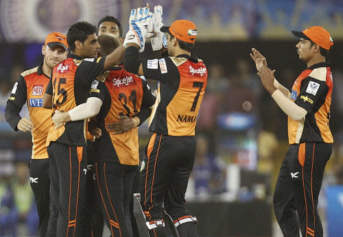 Sunrisers Hyderabad's bowler Bhuvneshwar Kumar (L) celebrate with team mates after taking wicket of Ajinkya Rahane (unseen) of Rajasthan Royals during their IPL-7 cricket match in Ahmedabad on Thursday. PTI Photo