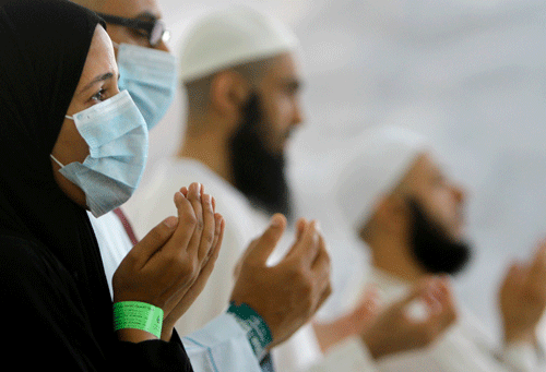 In this Thursday, Oct. 17, 2013 file photo, Egyptian Muslim pilgrims pray after they cast stones at a pillar, symbolizing the stoning of Satan, in a ritual called 'Jamarat,' the last rite of the annual hajj, in Mina near the Muslim holy city of Mecca, Saudi Arabia. Four more people have died in Saudi Arabia after contracting an often fatal Middle East respiratory virus as the number of new confirmed infections in the kingdom climbs higher, according to health officials. The Saudi health ministry said in a statement posted online late Wednesday, May 8, 2014 that 18 new confirmed cases of the Middle East Respiratory Syndrome were reported in the capital Riyadh, the western cities of Jiddah, Mecca and Medina, and in the city of Najran, along the border with Yemen. AP