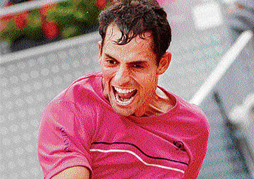 i did it: Santiago Giraldo exults after beating Andy Murray in the Madird Open. reuters