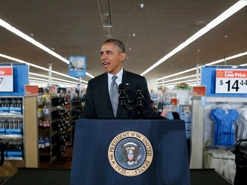 U.S. President Barack Obama speaks about energy during a visit to a Wal-Mart store in Mountain View,California May 9, 2014. Walmart will double by 2020 the number of on-site solar energy projects at its U.S. outlets and distribution centers, the company announced, during an event attended by Obama on Friday. REUTERS