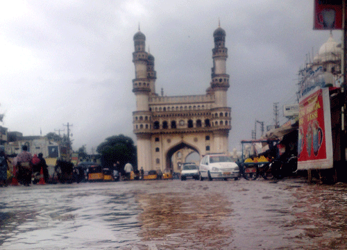 A view of a flooded road near the historic Charminar after heavy rains in Hyderabad on Friday. PTI Photo