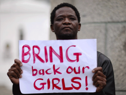 A protester holds a sign during a march in support of the girls kidnapped in Nigeria by members of Boko Haram, in Cape Town. The UN Security Council Friday strongly condemned the abduction of nearly 300 schoolgirls in Nigeria and attacks by extremist Islamic group Boko Haram, threatening to take measures against the insurgents. Reuters photo
