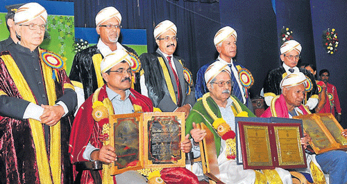 Anand Teltumbde, professor at Indian Institute of Technology, Kharagpur; G&#8200;H&#8200;Nayak, literary critic; and C P Krishnakumar, writer, were conferred with honorary doctorates during the 14th convocation of Karnataka State Open University, in Mysore, on Saturday. Governor H R Bhardwaj, Vice-Chancellor M G Krishnan, Registrar (Evaluation) K J Suresh, Registrar P S Nayak and others are seen. DH Photo