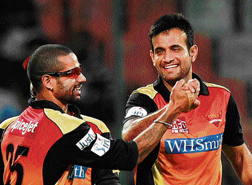 well done: Hyderabad's Shikhar&#8200;Dhawan (left) and Irfan Pathan celebrate the wicket of Delhi's Kedar Jadhav. pti