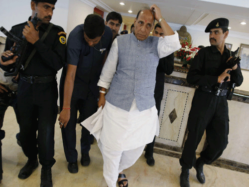 A day after Narendra Modi's long meeting with top RSS brass, BJP president Rajnath Singh today met senior Sangh leaders at the RSS office here. AP photo