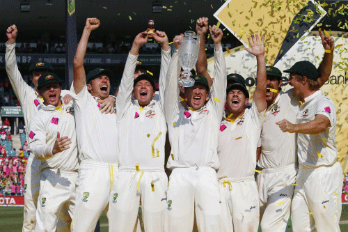 Australia's captain Clarke holds up the 'Replica Ashes Urn' as he celebrates with teammates after winning the fifth Ashes cricket test against England at the Sydney Cricket Ground.England will be hoping history repeats itself when their bid to regain the Ashes next year starts in Cardiff. Reuters photo