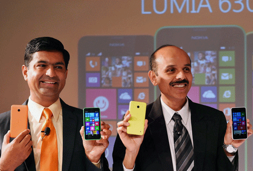 Nokia India Managing Director, P Balaji with Director, Smartphone Devices, Nokia India, Middle East and Africa, Vipul Mehrotra (L) at the Microsoft launches Nokia Lumia 630, in New Delhi on Monday. PTI