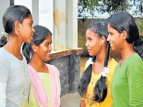 Inmates of Juvenile Home for Girls celebrate their success in SSLC exams, in Mysore, on Monday. DH Photo