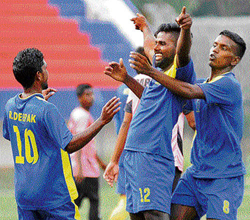 i've done it!: ADE's Vijay Karthik (12) celebrates his goal with team-mates during their game against South United at the Bangalore Football Stadium on Tuesday. DH photo