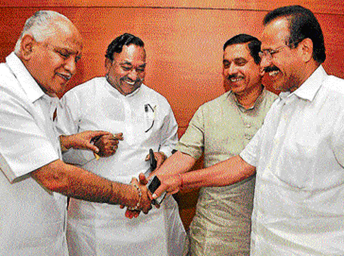 camaraderie: BJP leaders B S Yeddyurappa, K S Eshwarappa, Pralhad Joshi and D V Sadananda Gowda at the party's core committee meeting in Bangalore on Tuesday. dh photo