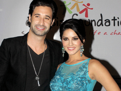Bollywood actor Sunny Leone with her husband Daniel Weber at an event in Mumbai. PTI photo