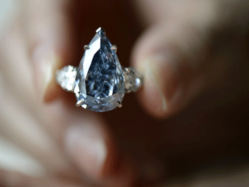 The world's largest flawless vivid blue diamond sold for USD 23.79 million at Christie's auction, which realised a total of USD 154.19 million, the highest total ever for a jewellery sale, auctioneers said today. AP photo