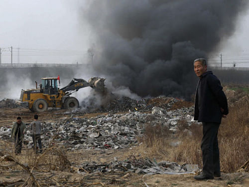 Though a WHO report has named India's capital New Delhi as the most polluted city in Asia, Beijing should not rejoice at being second, a leading Chinese daily said. Reuters photo