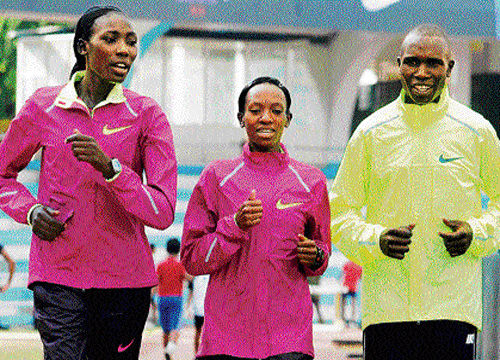 kenyan conquerors: Geoffrey Kipsang Kamworor (right) with Lucy Kabuu (centre) and LInet Masai in Bangalore on Thursday. dh photo