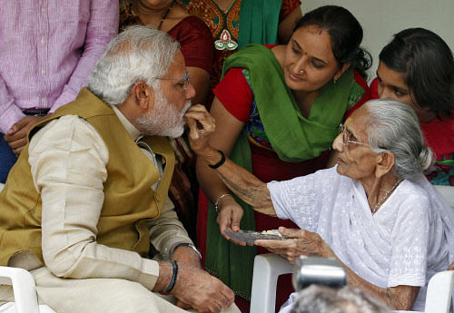Hindu nationalist Modi, prime ministerial candidate for India's main opposition BJP, seeks blessings from his mother Heeraben at her residence in Gandhinagar