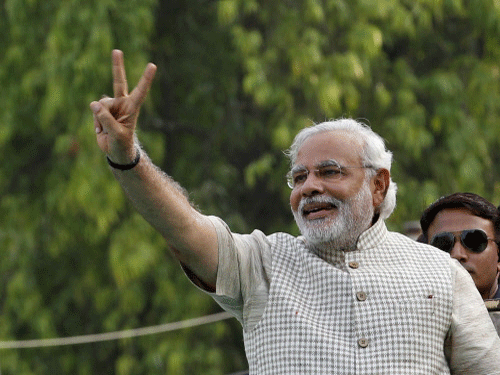 The sounds of hooting, clapping, whistling and sloganeering resonated in the air as Narendra Modi, all set to become India's 14th prime minister, met with rockstar adulation here as he delivered his first speech following BJP's impressive victory in the Lok Sabha poll. Reuters photo
