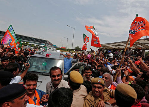 Narendra Modi arrived here today to a rousing welcome, a day after storming to power with a landslide victory in the Lok Sabha elections. Reuters