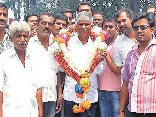Newly-elected MP C S Puttaraju being felicitated by party workers in Mandya, on Saturday. DH photo