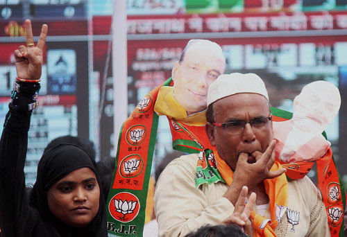 Muslim BJP workers celebrating the party's victory in Lok Sabha polls, in Lucknow on Friday. PTI Photo