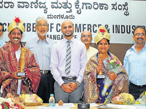 Mayor Mahabala Marla and Deputy Mayor Kavitha Vasu being felicitated by KCCI President Mohammed Ameen and others at KCCI in Mangalore on Monday. DH photo