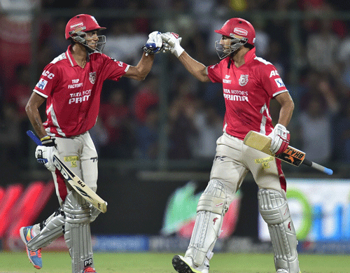 Kings XI Punjab's A Patel and R Dhawan celebrate after their win during the IPL 7 match against Delhi Daredevils in New Delhi on Monday. PTI Photo