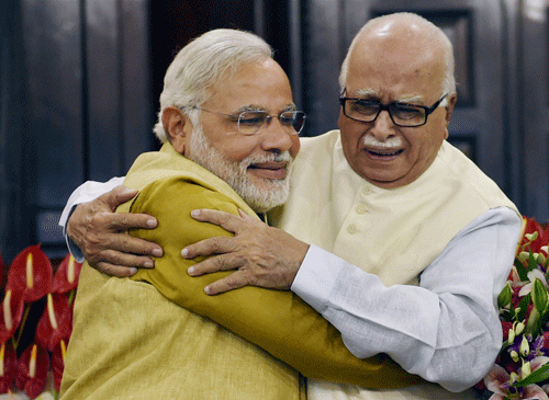 ''Advaniji said that I have done a favour to BJP. Like India, BJP is also my mother. Can serving the mother be a favour? Not at all. A son is only dedicated to serve the mother,''said an emotional Modi. PTI photo