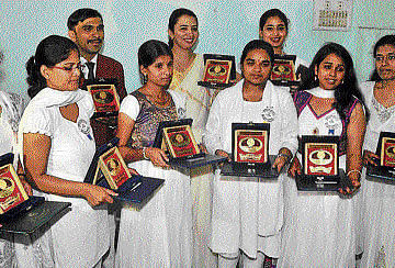ACHIEVERS: (From left) Shruthi D L (7 gold medals in MSc); Mohitha S M (5 golds in BE); Rajendra Bhat, (6 golds in MA); Chitra N (3 golds in BSc); Rashmi S Baliga, (3 golds in BEd); Aishwarya N A (5 golds in BCom); Anusha G (4 golds in BA); Roopa S (4 golds in Economics) and Noorjan A R (6 golds in MSc) at the annual convocation of Bangalore University in Bangalore on Tuesday. DH&#8200;Photo