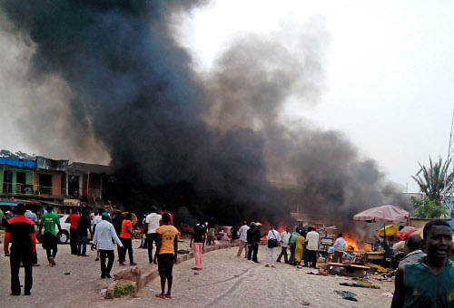 Smoke rises after a bomb blast at a bus terminal in Jos, Nigeria. AP photo