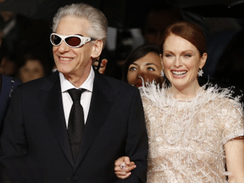 Director David Cronenberg, and actress Julianne Moore arrive for the screening of Maps to the Stars at the 67th international film festival, Cannes. AP photo