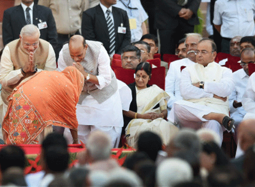 : SAD leader Harsimrat Kaur seeks blessings of Prime Minister Narendra Modi and Rajnath Singh after taking oath as a minister at the swearing-in ceremony of the NDA government at Rashtrapati Bhavan in New Delhi on Monday. PTI Photo