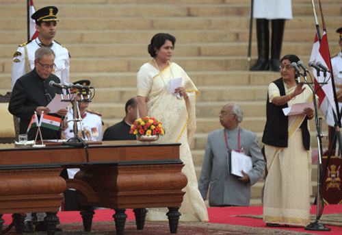 President Pranab Mukherjee administers oath to Sushma Swaraj at a ceremony at Rashtrapati Bhavan in New Delhi on Monday. PTI Photo