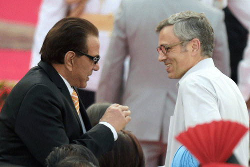 J&K Chief Minister Omar Abdullah and actor Dharmendra at the swearing-in ceremony of the NDA government at Rashtrapati Bhavan in New Delhi on Monday. PTI Photo