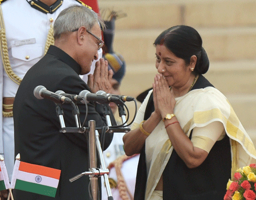 President Pranab Mukherjee greets newly sworn-in minister Sushma Swaraj after administering her the oath at a ceremony at Rashtrapati Bhavan in New Delhi on Monday. PTI Photo