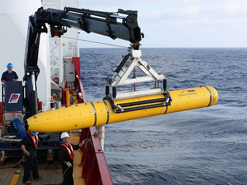 Crew aboard the Australian Defence Vessel Ocean Shield move the U.S. Navy's Bluefin-21 autonomous underwater vehicle into position for deployment in the southern Indian Ocean to look for the missing Malaysia Airlines flight MH370. Reuters photo