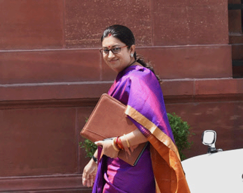 HRD Minister Smriti Zubin Irani arrives at PMO to attend the Cabinet Meeting in New Delhi on Thursday. PTI Photo