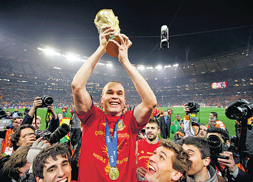 Andres Iniesta, who scored the sensational winner in the final, with the prized possession.